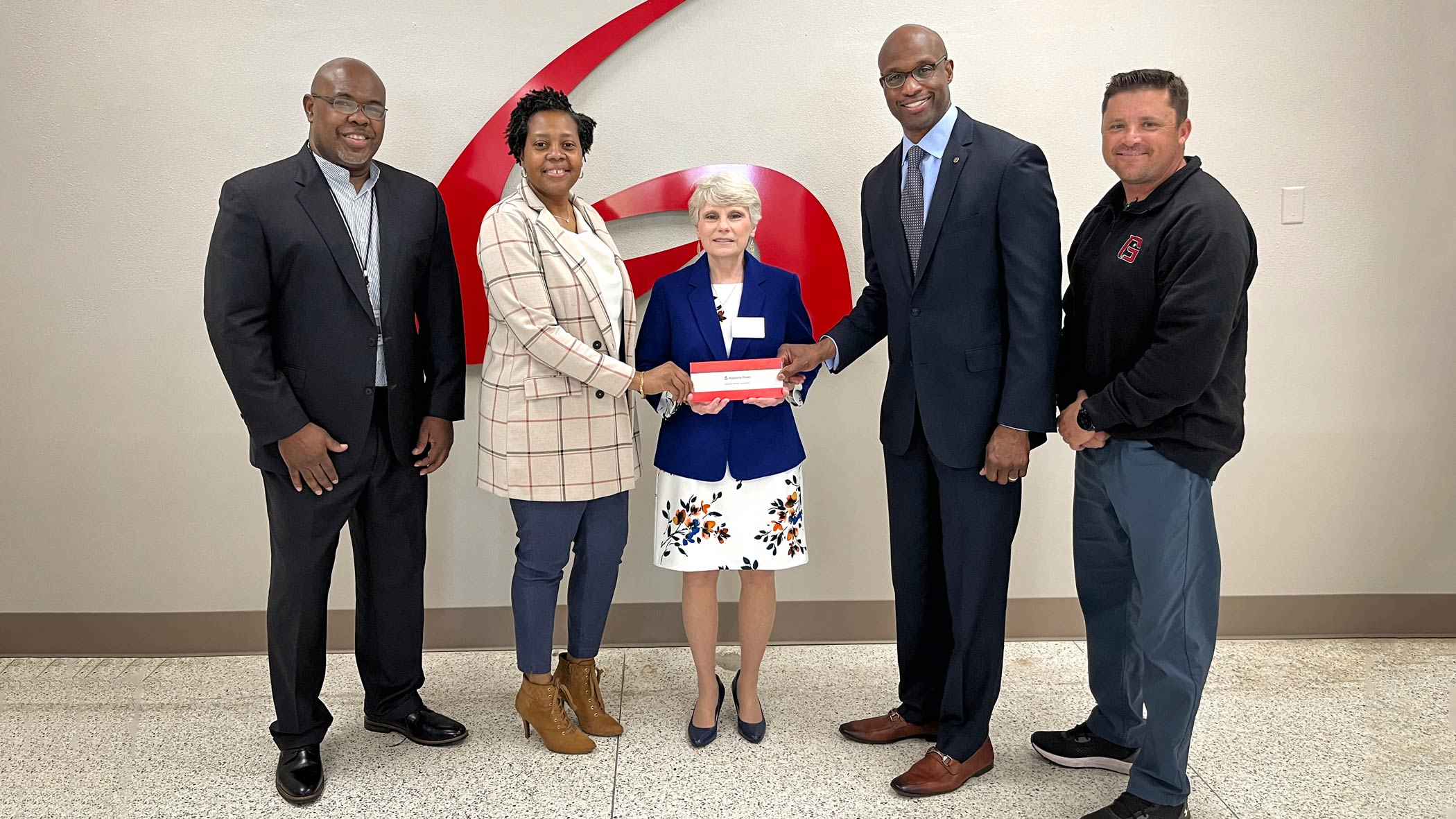 A check for $50,000 was presented to Dr. Kathy Murphy, middle, president of Gadsden State, and to Blake Lewis, far right, athletic director. Pictured are, from left, Spencer Williams, community relations manager in Etowah County; Dana McFarland, community relations manager in Calhoun County; and Terry Smiley, vice president of Alabama Power?s Eastern Division.